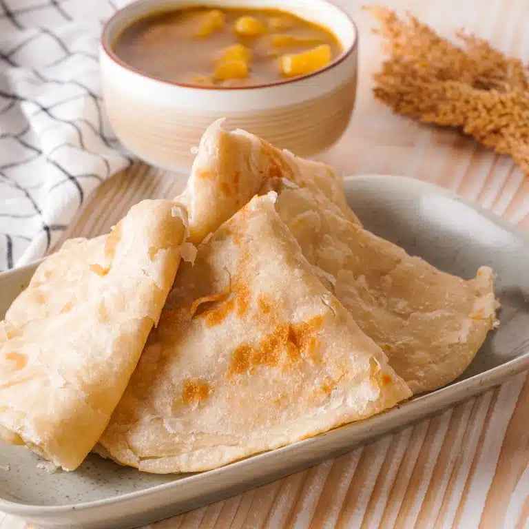 Food spread with rice, curry and triangular pastries