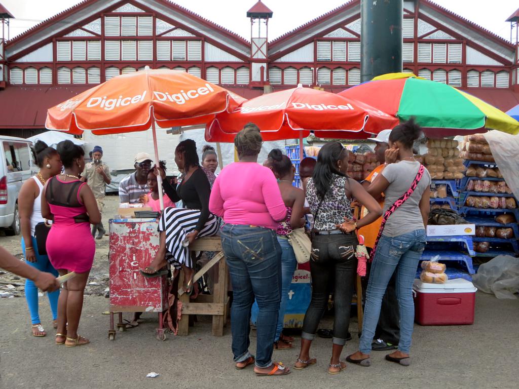 Guyanese shoppers at a stall outside Stabroek Market in Georgetown