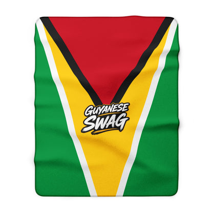 Guyana flag Sherpa blanket styled on a sofa