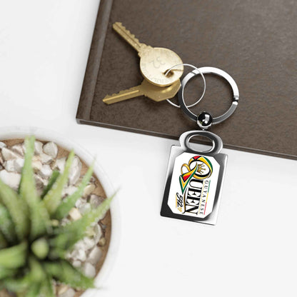 Guyanese Queen 592 Rectangle Keychain, keychain shown with keys
